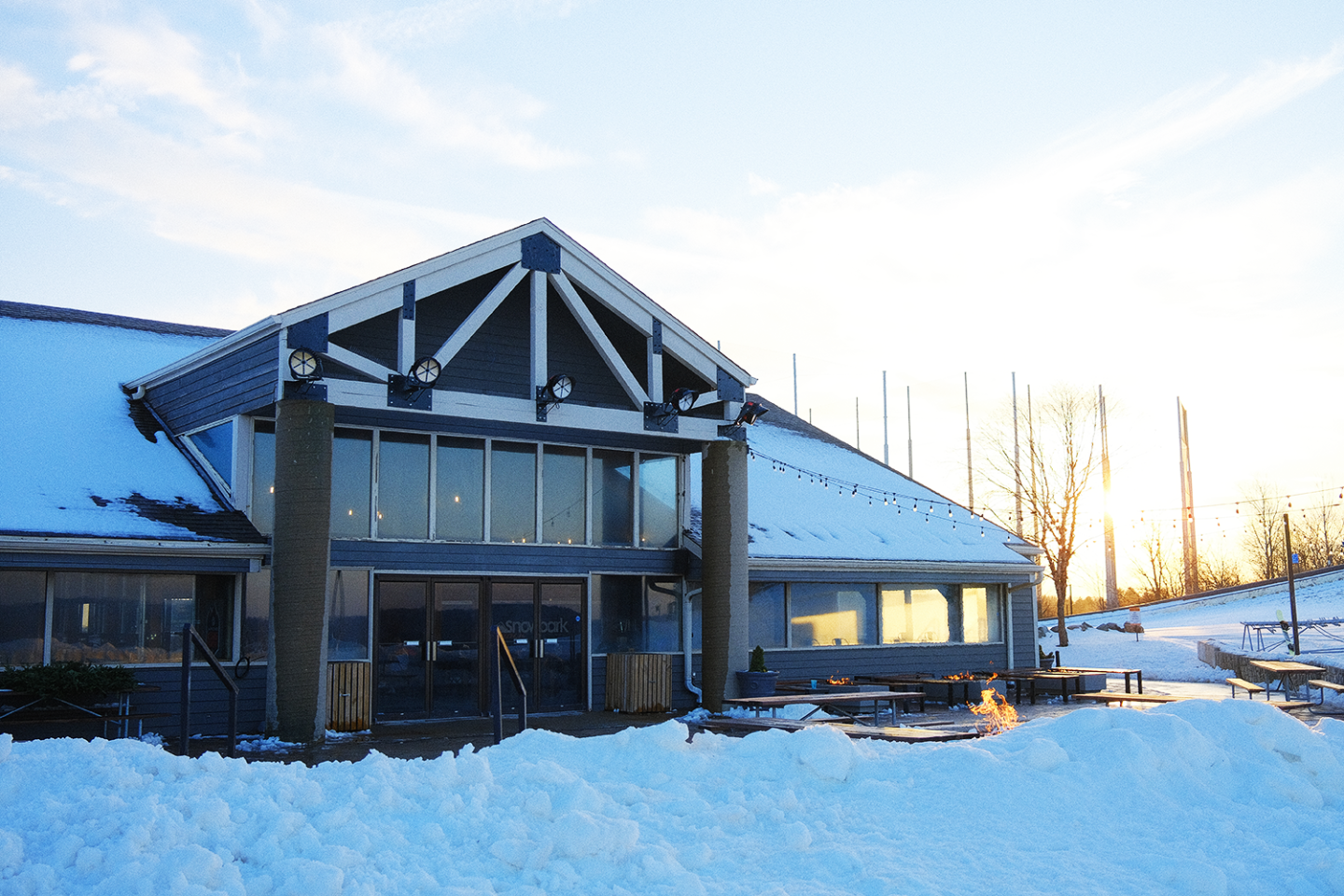 Mountain lodge in front of sunset