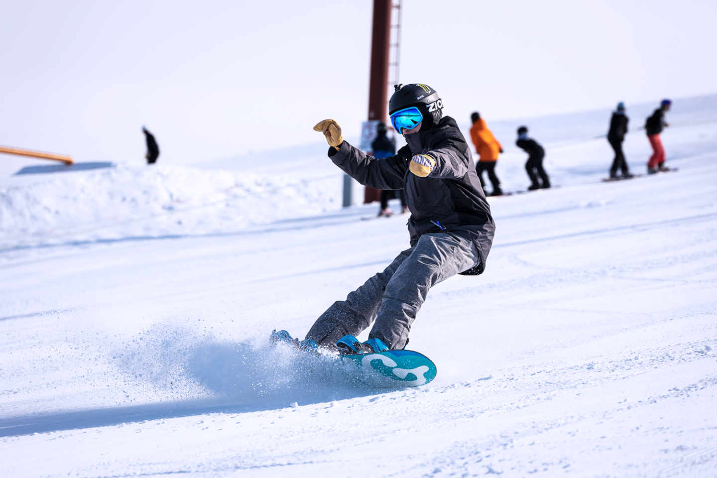 snowboarder shredding down hill