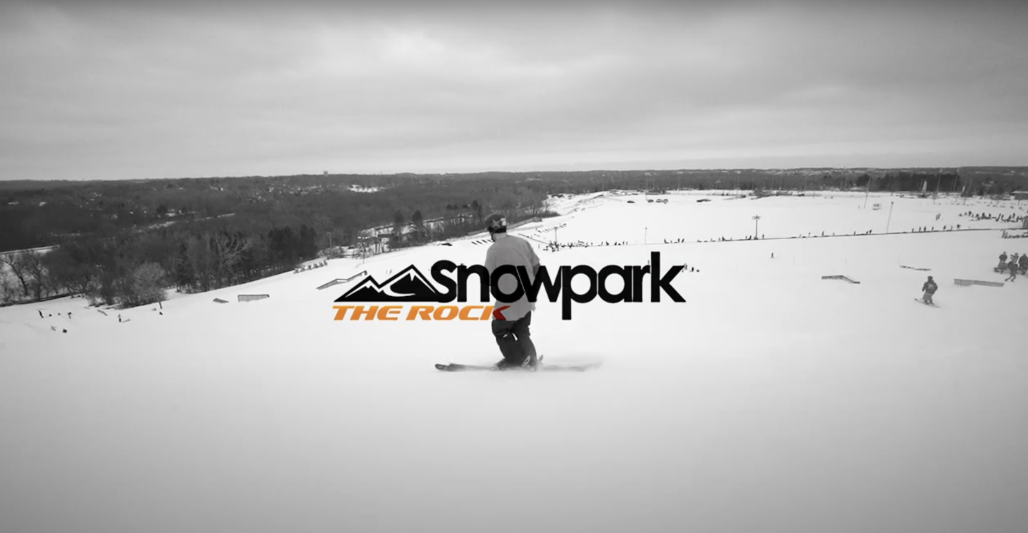 skier going down hill, with video graphic over top