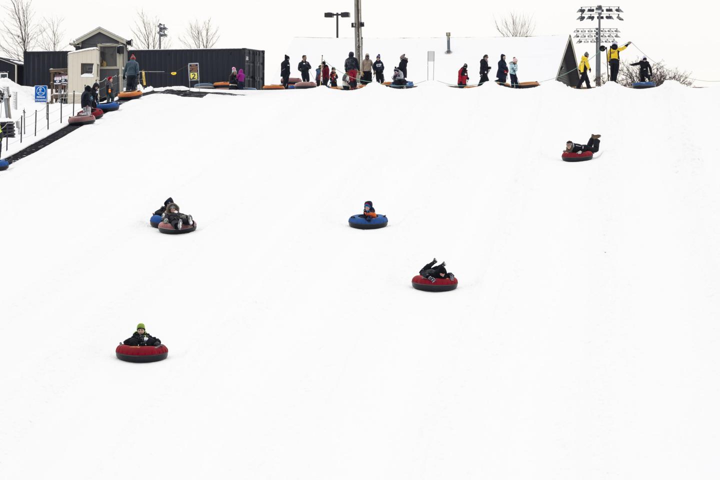 kids tubing down hill